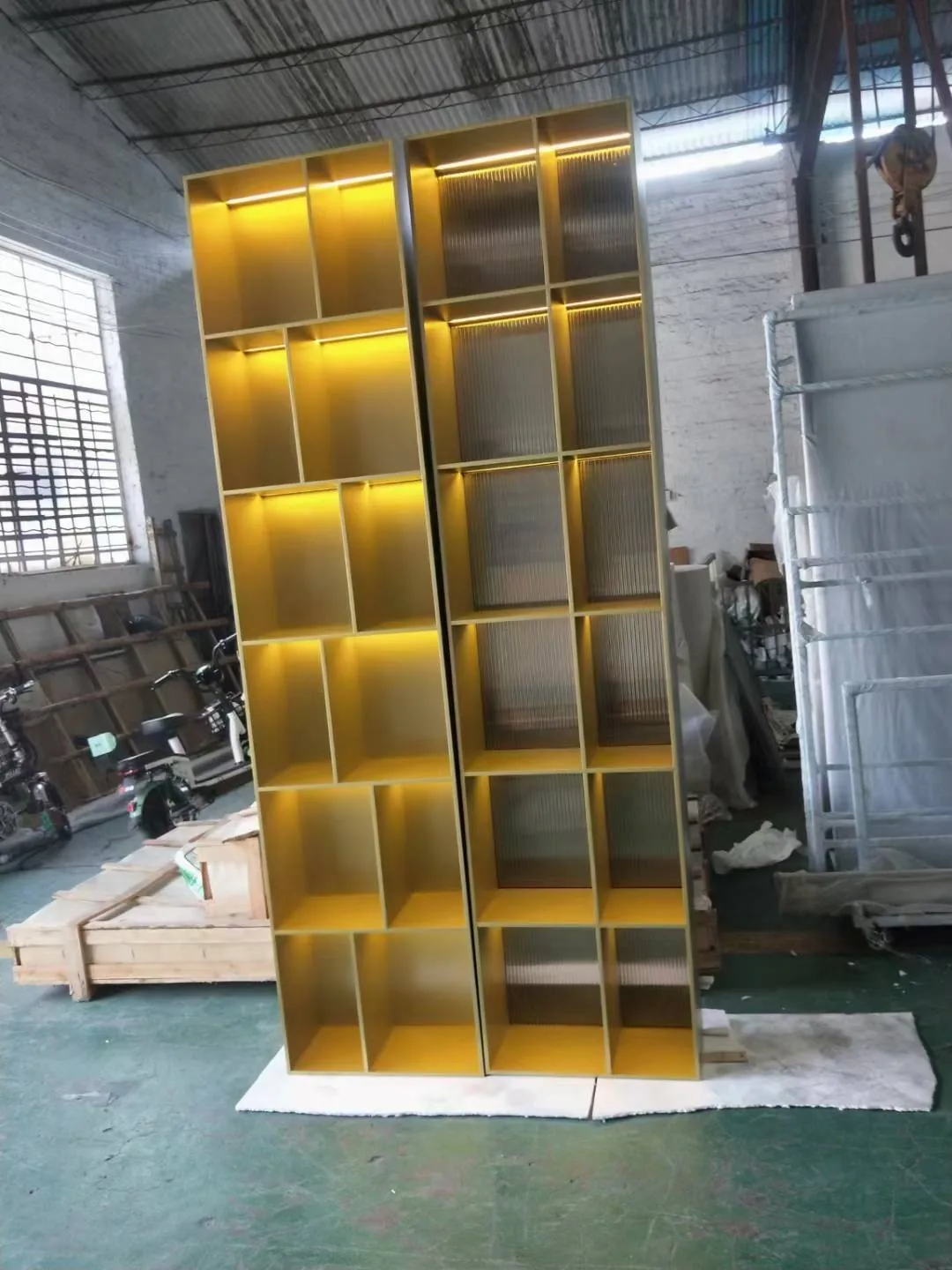 Champagne-tone illuminated architectural display cabinet